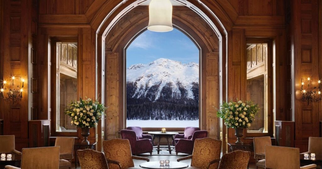 a room with a view of a snowy mountain