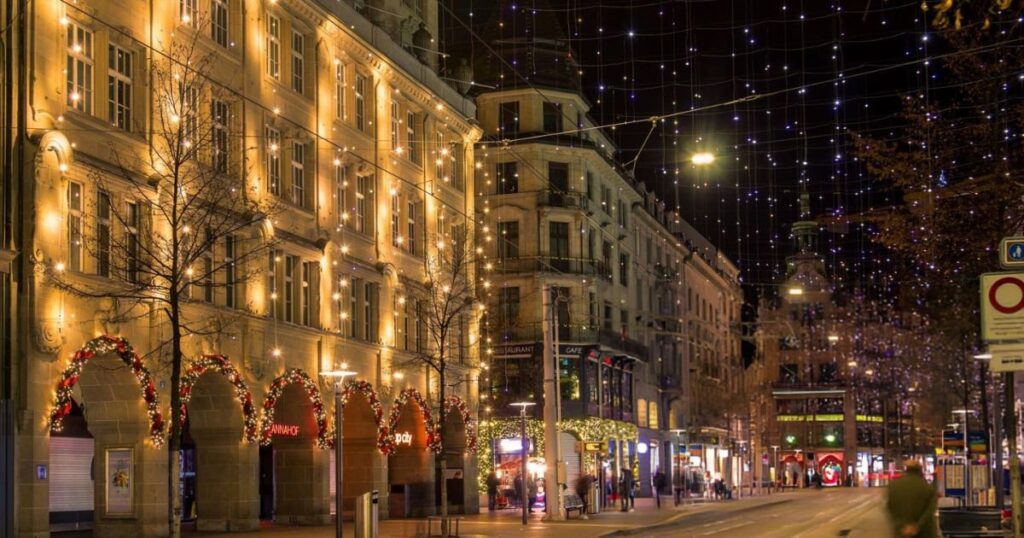 a street with buildings and lights